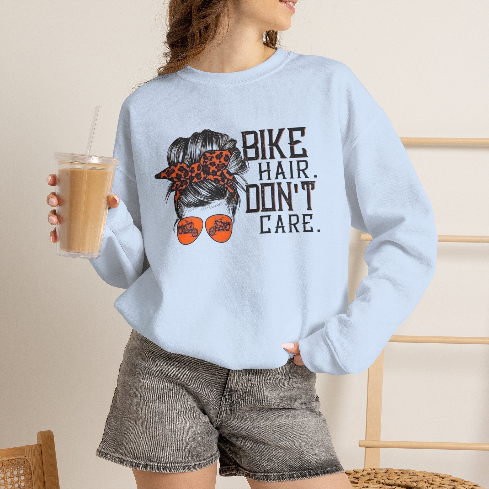 Crewneck Sweatshirt — “Bike Hair Don’t Care” Biker Messy Bun Graphic by Printify